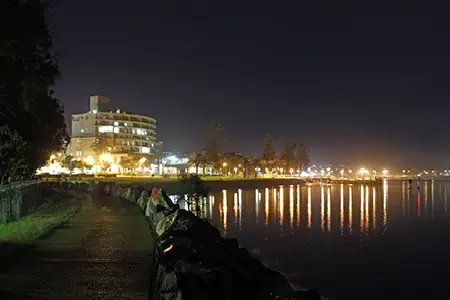 Port Macquarie at night with lights reflecting on the Hastings River